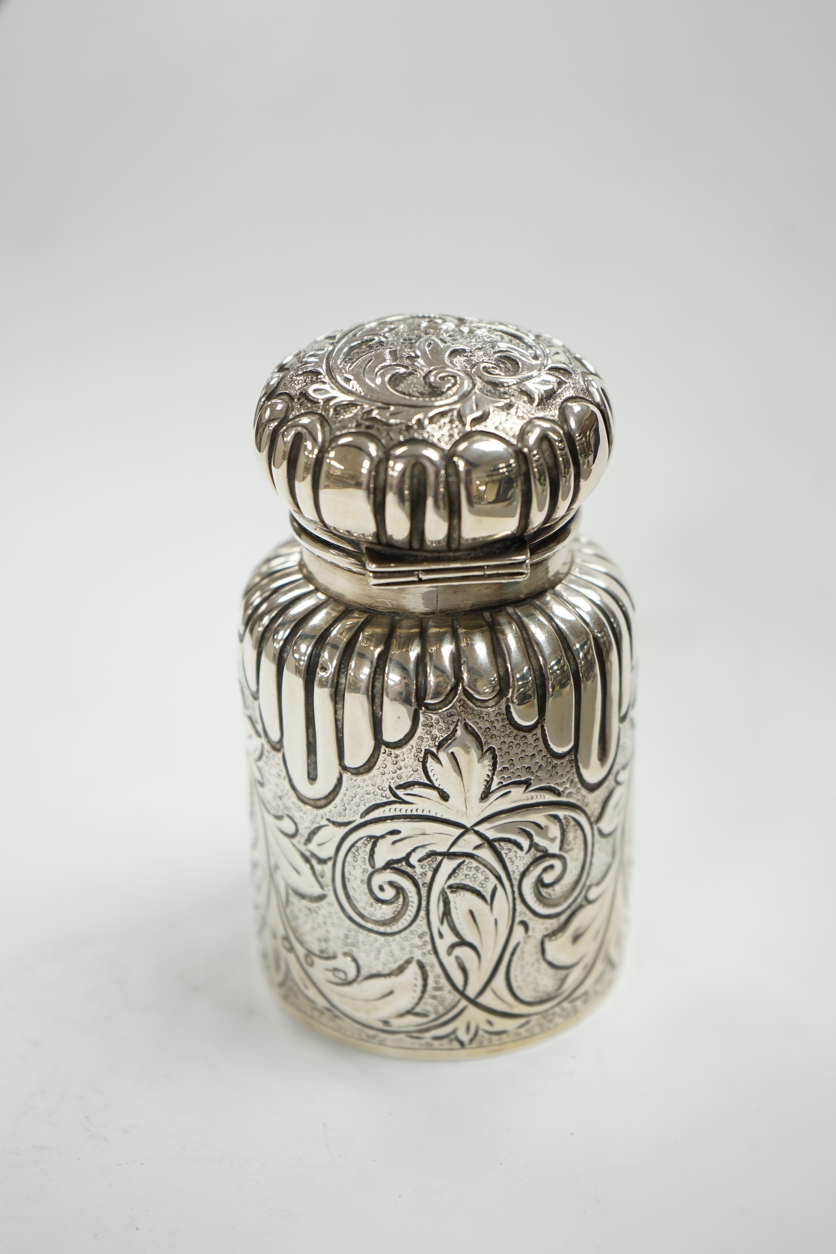 A late Victorian embossed silver scent bottle, by Arthur Wilmore Pennington, Birmingham, 1890, 95mm. Condition - poor to fair